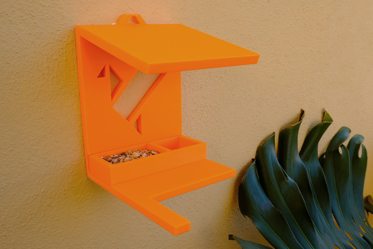 Bird feeder with removable container for food and water.